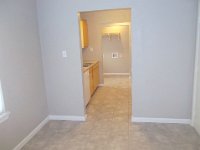 Looking from the dining room through the kitchen into the laundry area.  Dining room looking through the kitchen into the laundry area.