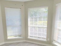 Bay window in 2nd bedroom with ceiling fan